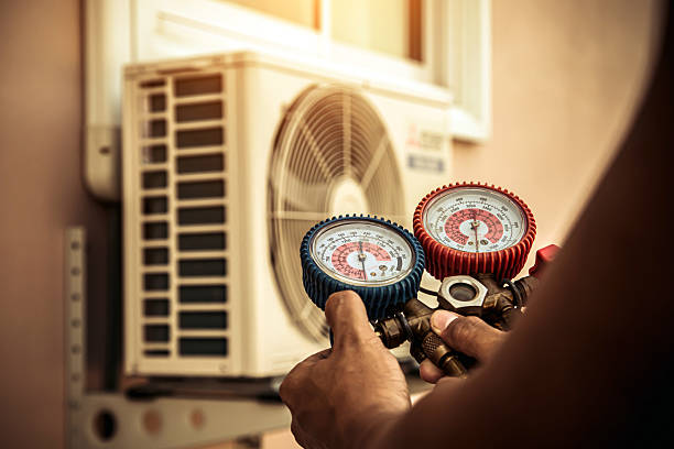 Professional Hvac technician working in Byfield, MA